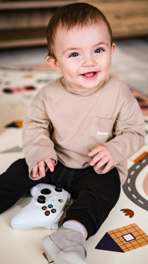 Adorable Baby Playing with Game Controller at Home